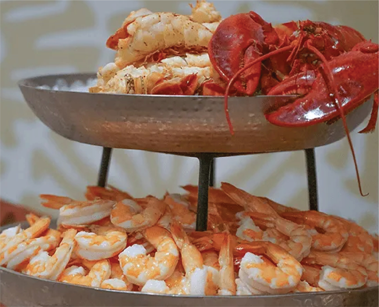 Seafood tower with lobster and shrimp at a catered event